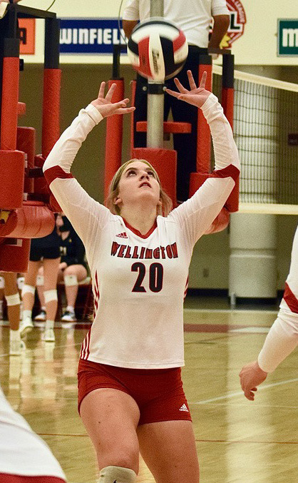 Senior volleyball player Katelyn Kessler sets the ball during a game